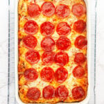 Overhead view of finished casserole on wire colling rack.