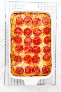 Overhead view of finished casserole on wire colling rack.