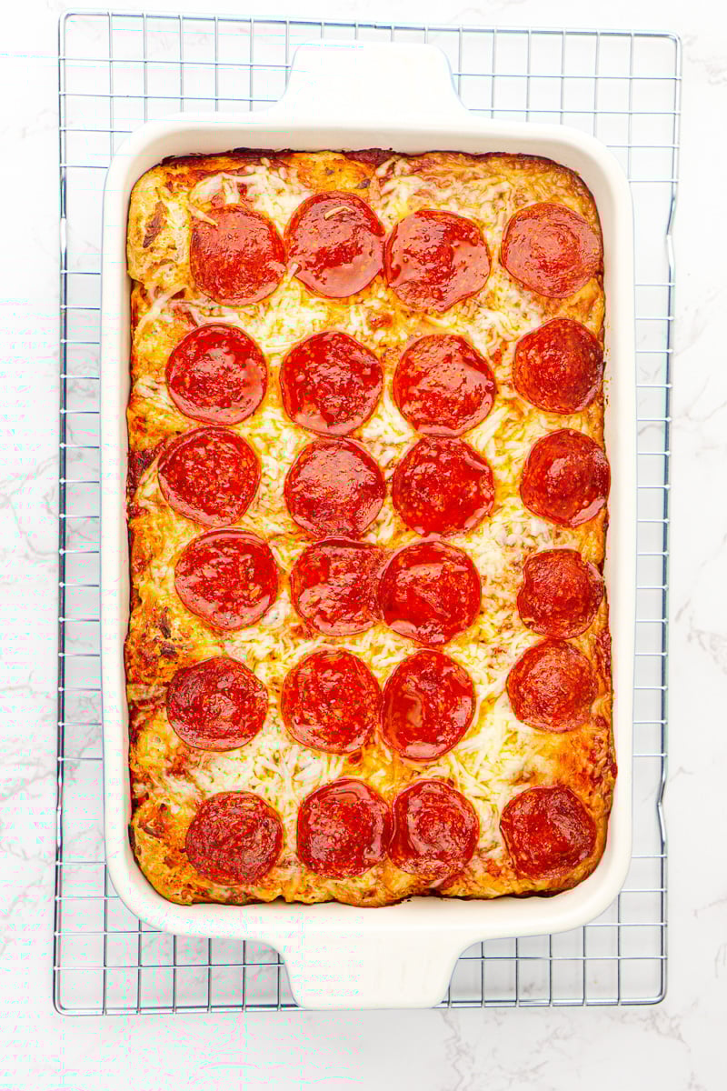 Overhead view of finished casserole on wire colling rack.