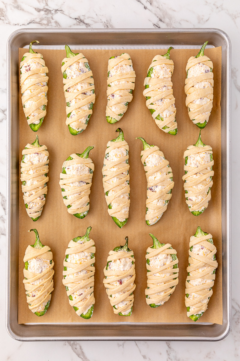 Jalapenos are stuffed with cream cheese mixture.