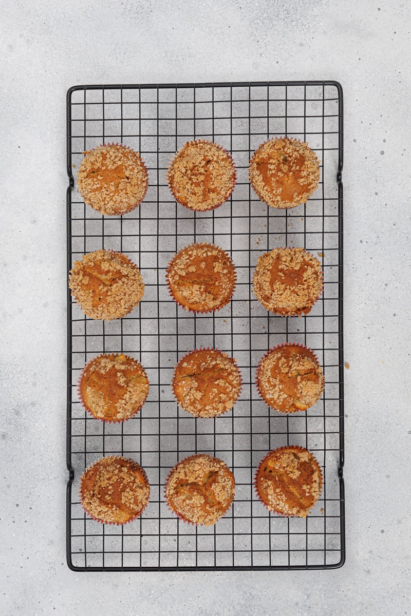 Baked muffins on wire cooling rack.