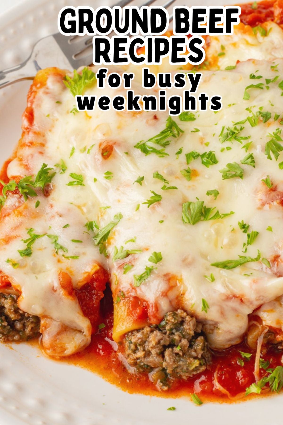 Ground beef canneloni served on a dinner plate.