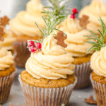 Gingerbread cupcakes in a group on a board.
