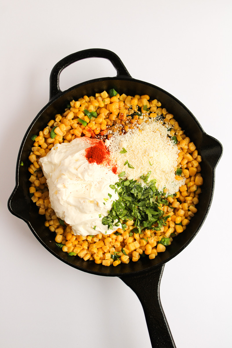 Remaining corn and remaining ingredients are added to cast iron skillet.