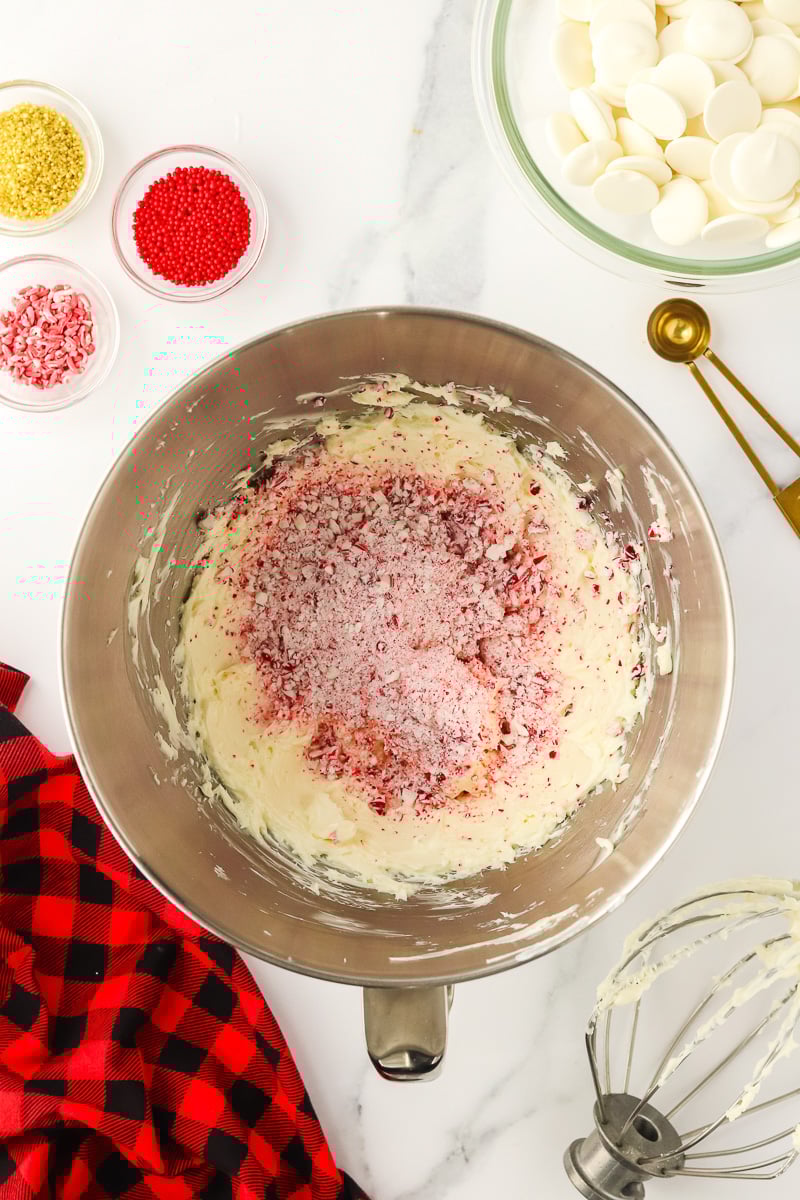 Crushed candy canes are added to the cream cheese mixture.