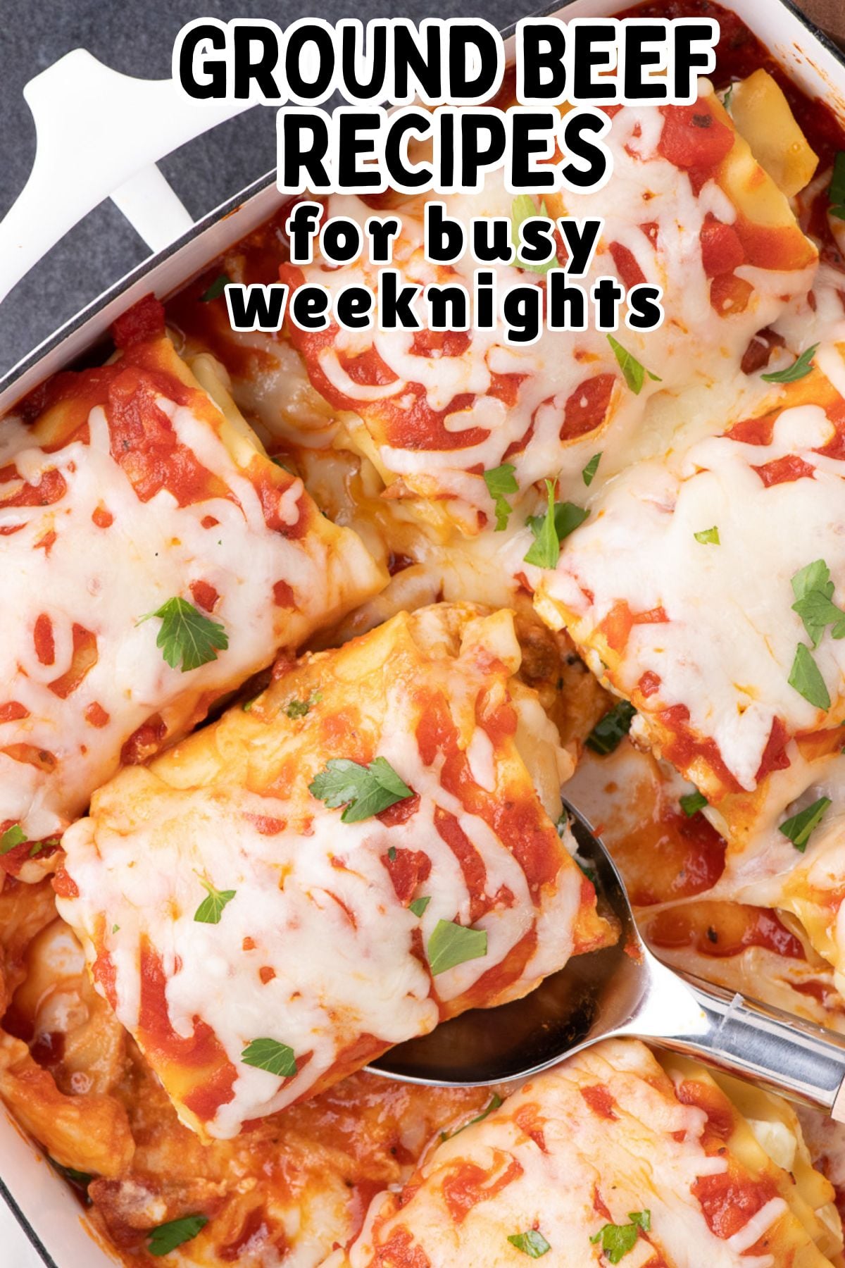 Lasagna rollups overhead view of casserole on kitchen counter.