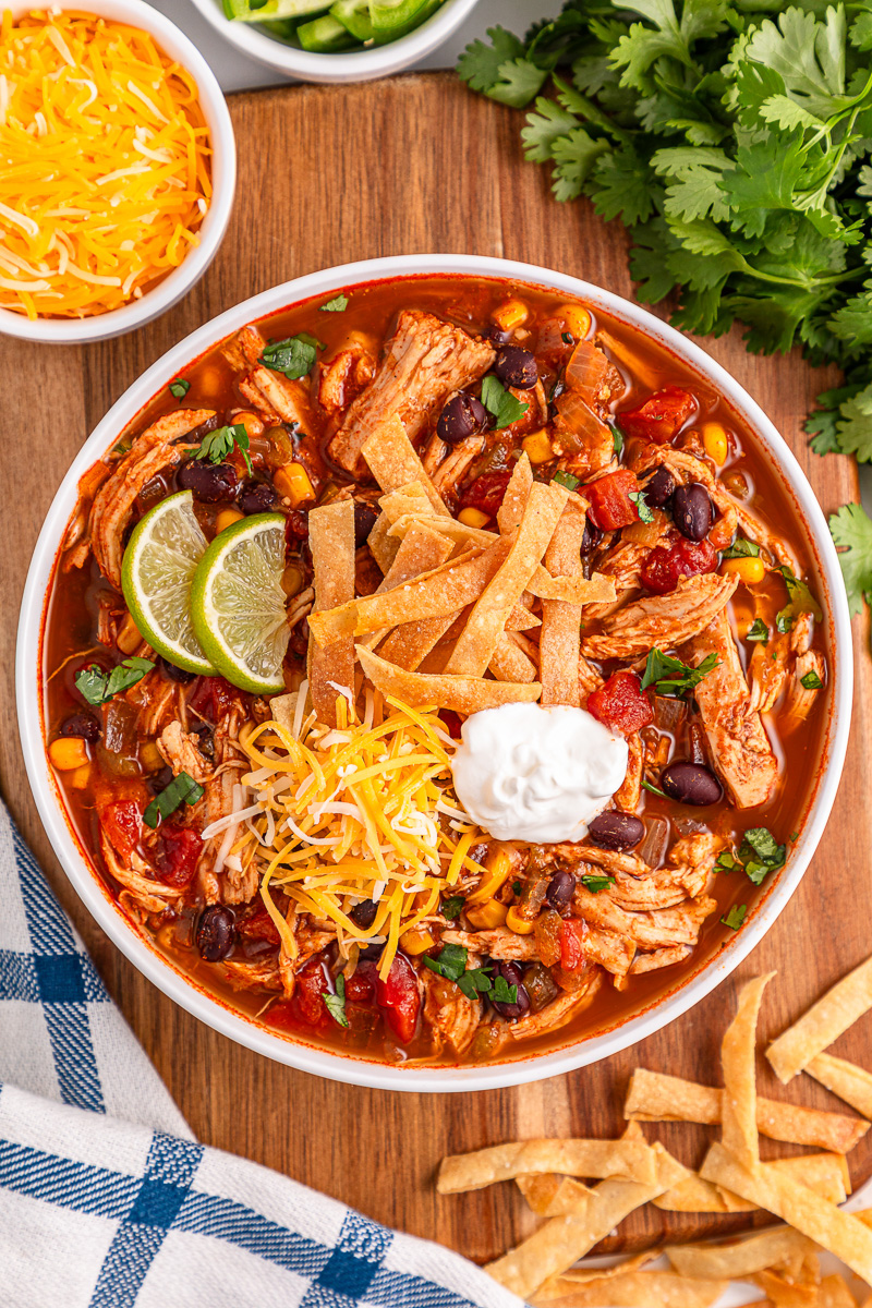 Chicken tortilla soup in a white bowl.