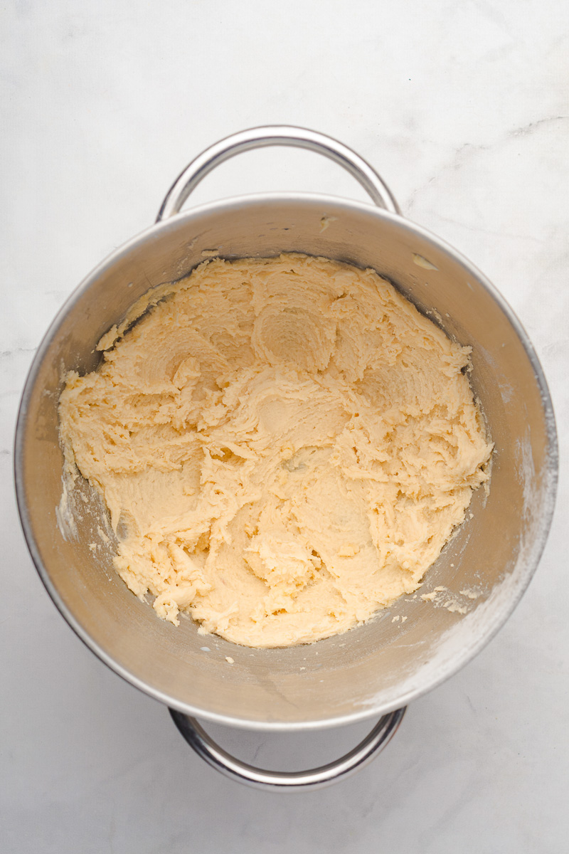 Buttercream frosting in mixing bowl.