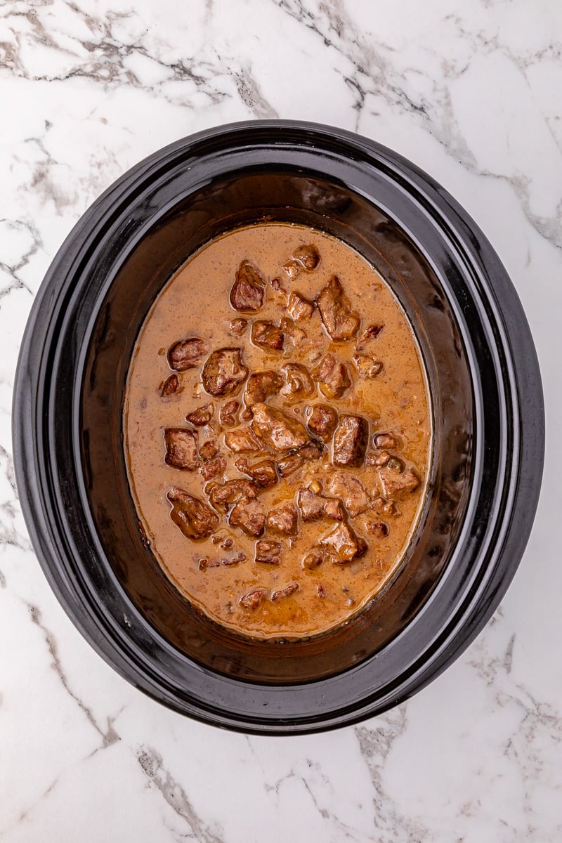 Cooked beef tips in slow cooker.