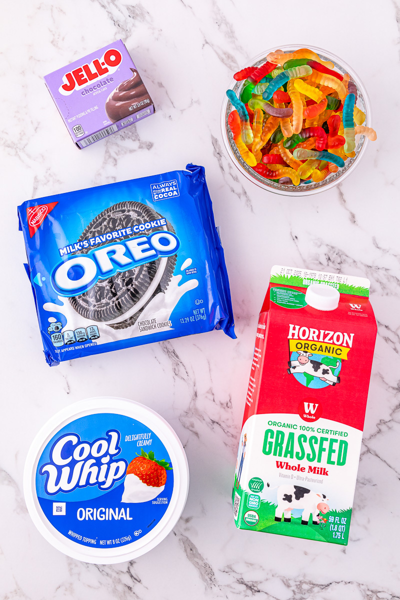 Ingredients for Oreo dirt cups on kitchen counter.