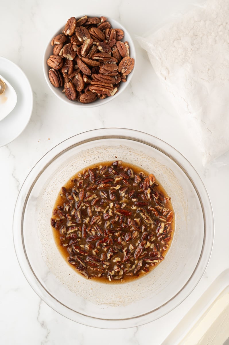 Pecan and corn syrup mixture in baking dish.