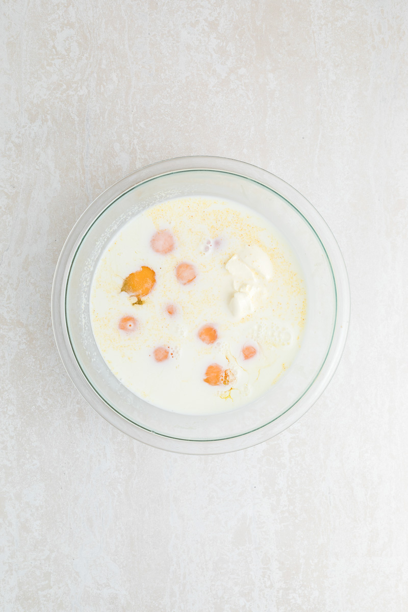Eggs and milk in bowl.