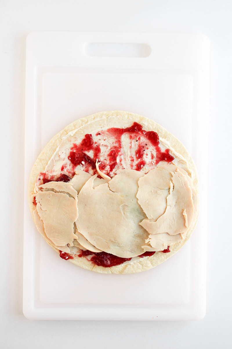 Turkey sices are added to the top of the cranberry sauce.