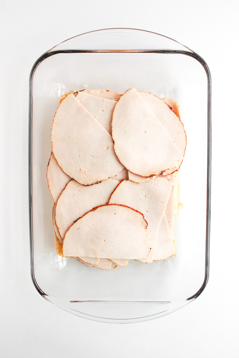 Turkey slices are placed on top of mayonnaise.