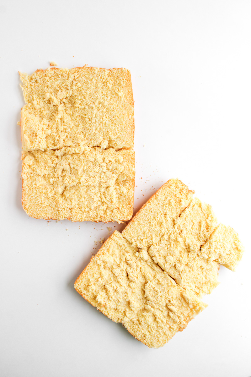 Hawaiian rolls are sliced in half.