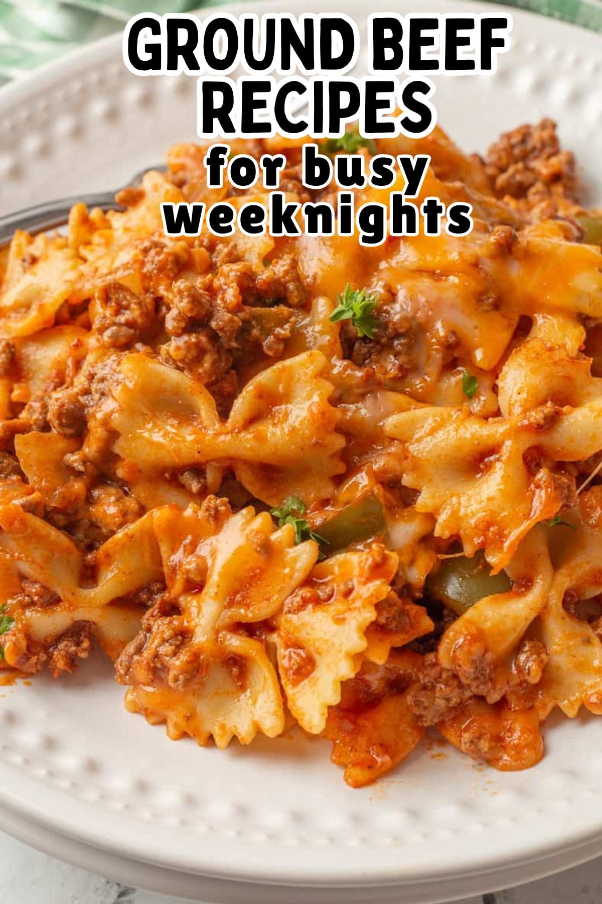 Sloppy Joe casserole with noodles served on a white plate.