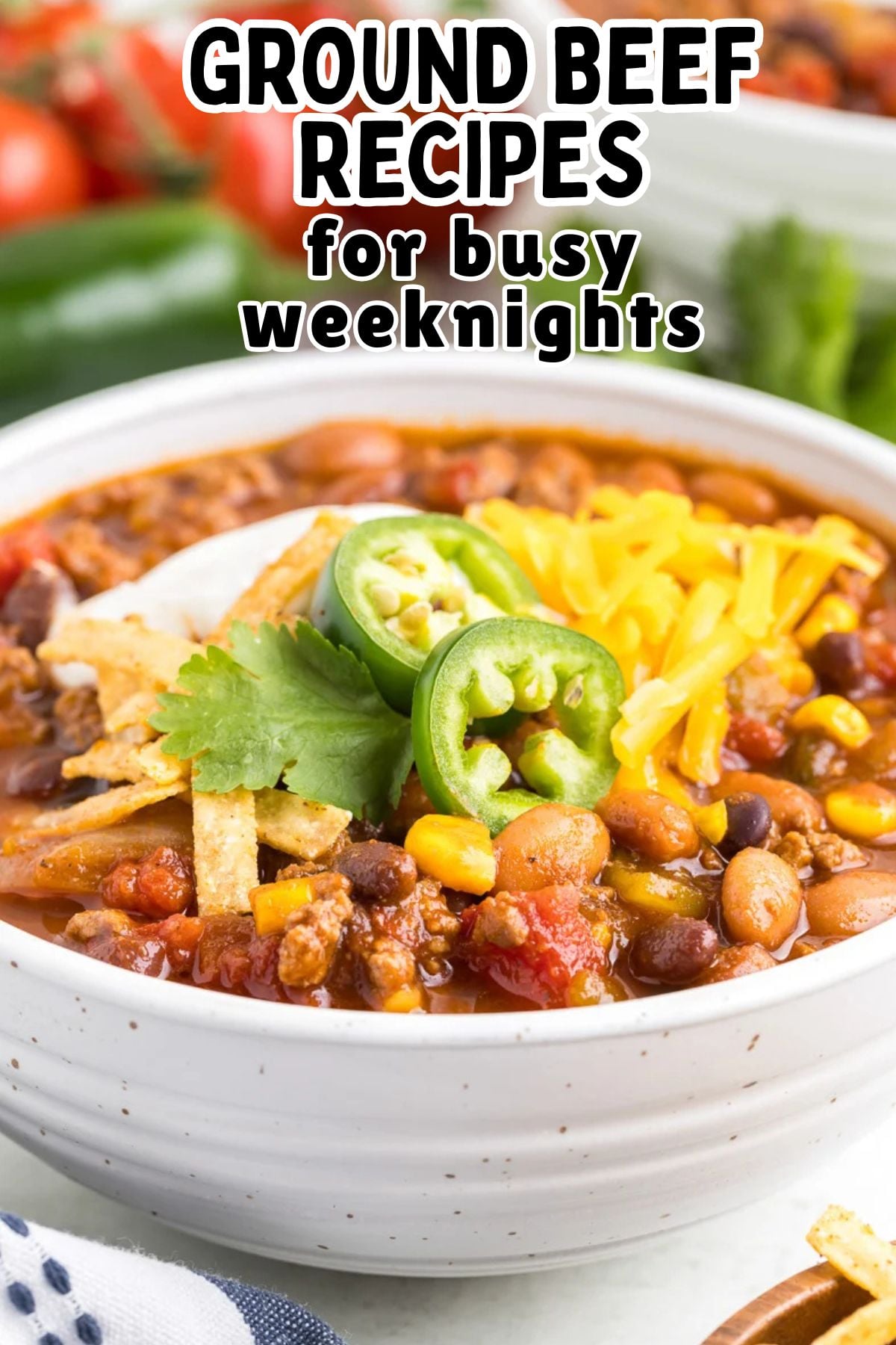 Taco soup with ground beef in a white bowl.