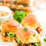 Cowboy sliders on a white plate.