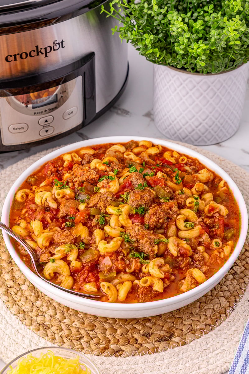 Goulash with ground beef served in a white bowl.