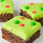 Grinch brownies cut and served on a white plate.