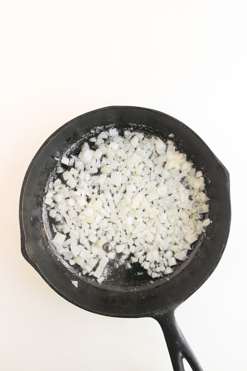 Onions cooking in skillet.