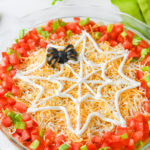 Halloween party taco dip in pie plate.