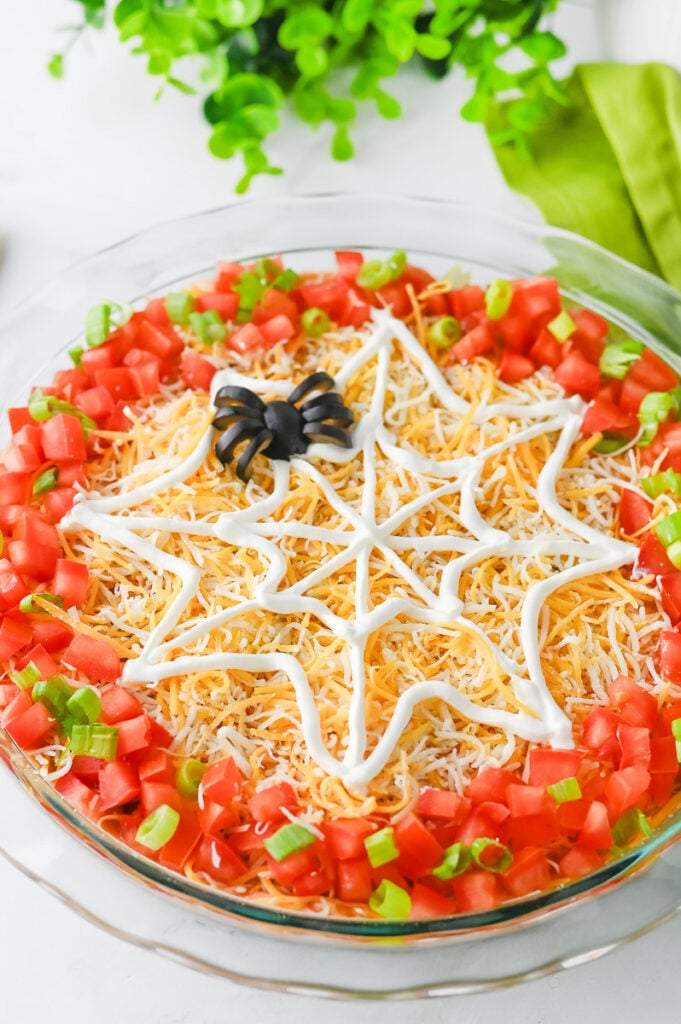 Halloween party taco dip in pie plate.