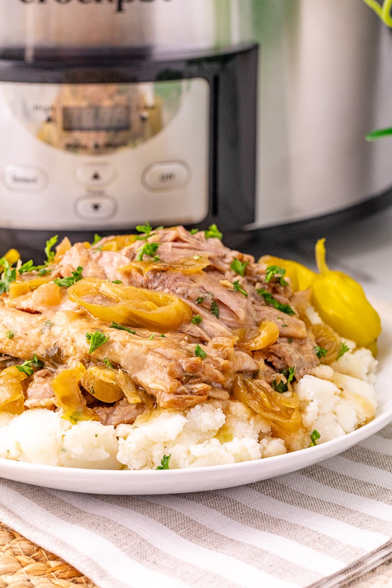 Mississippi pork roast on a bed of mashed potatoes.
