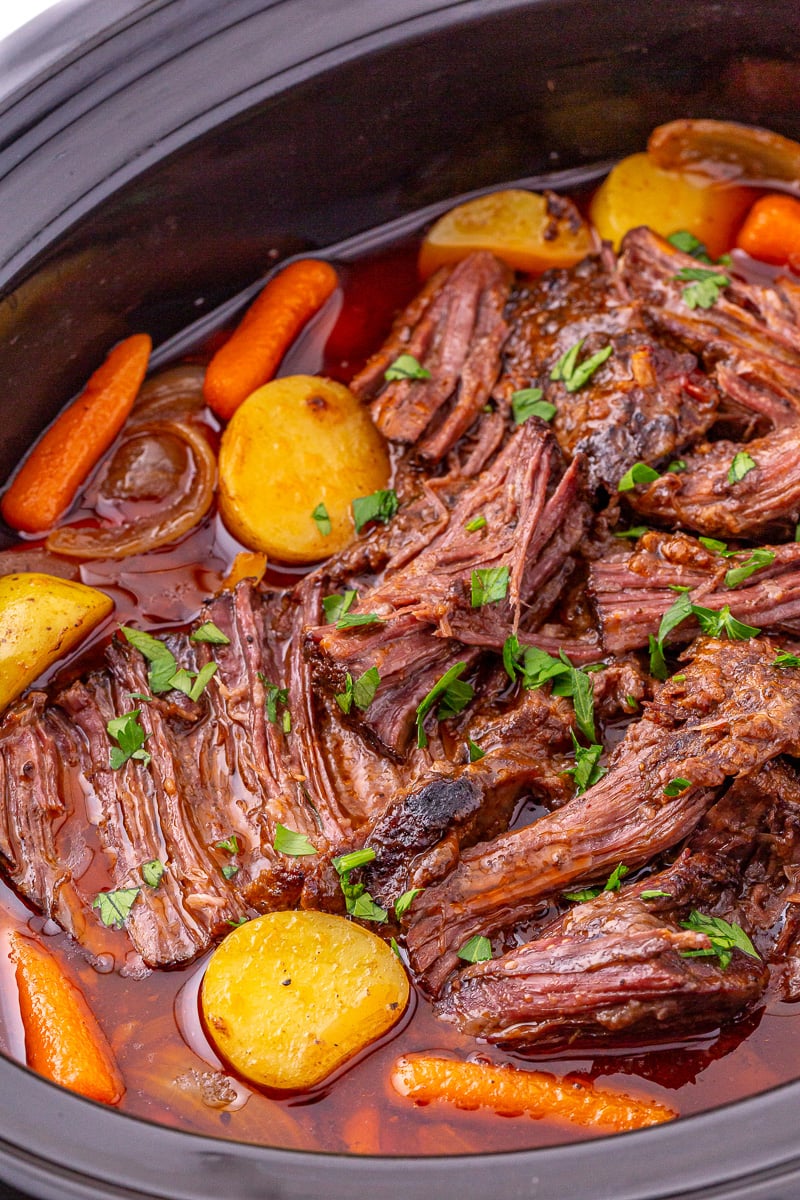 Finished slow cooker pot roast in crockpot, ready to be served.