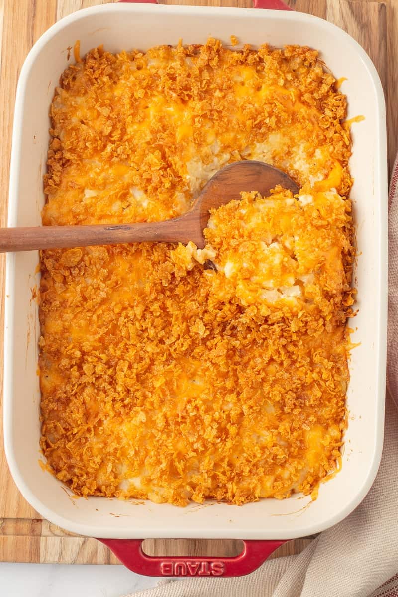 Funeral potatoes in bac dish, the ultimate potluck food.