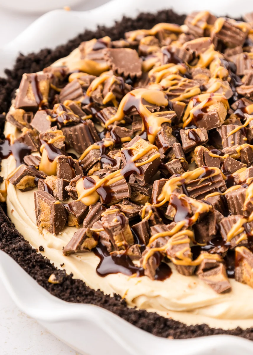 One of the classic Thanksgiving desserts that aren't pumpkin is this no bake peanut butter pie in a white pie dish.