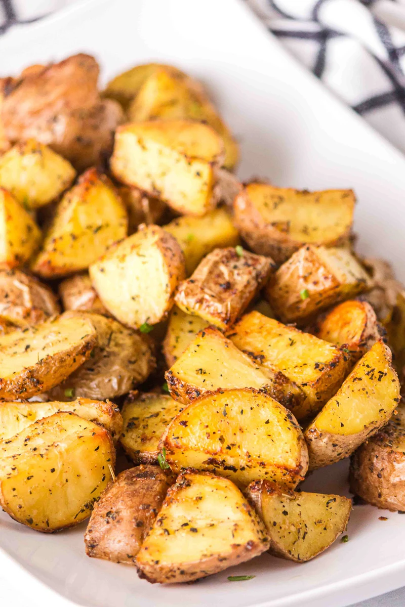 Crispy roasted red potatoes served on a platter.