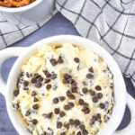 Chocolate chip dip served in a white bowl.