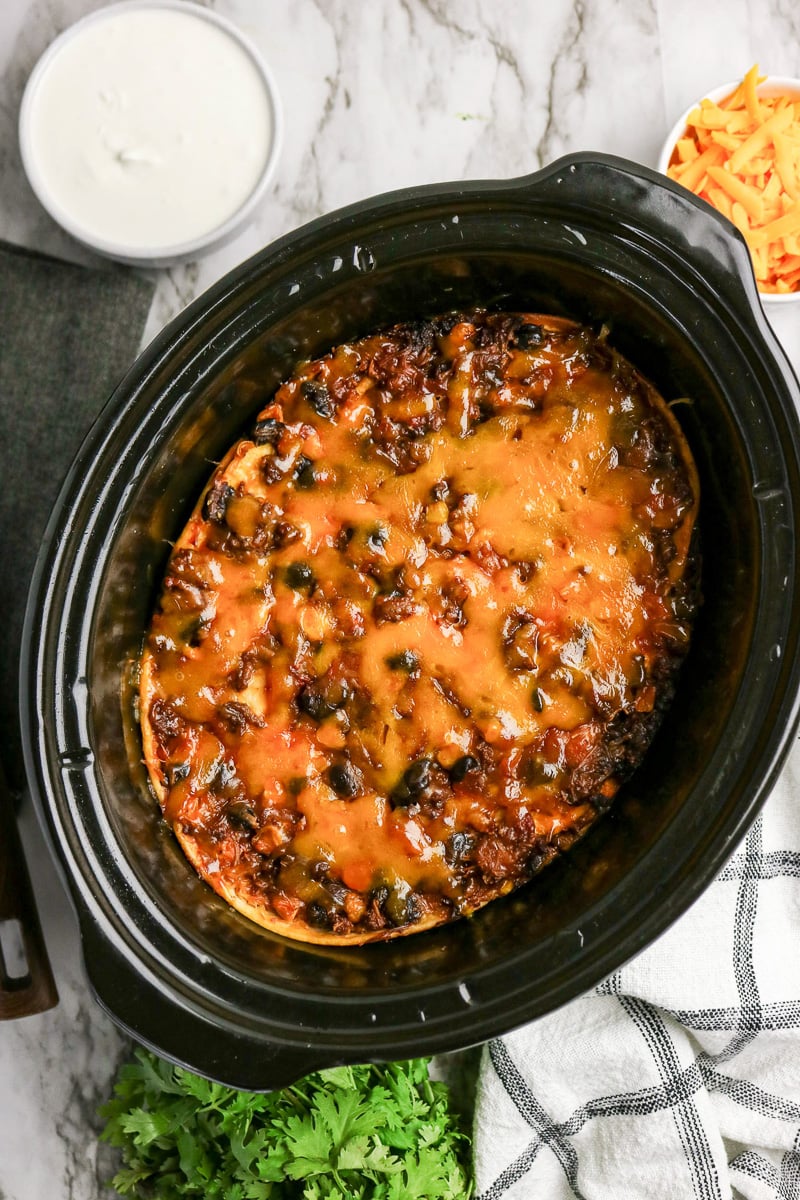 Cooked taco casserole in slow cooker.
