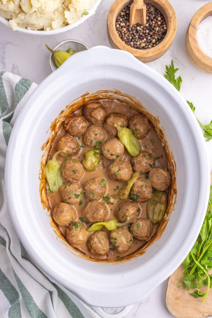 Slow cooker Mississippi meatballs in slow cooker, ready to be served for game day.