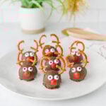Reindeer Oreo balls on a white plate.