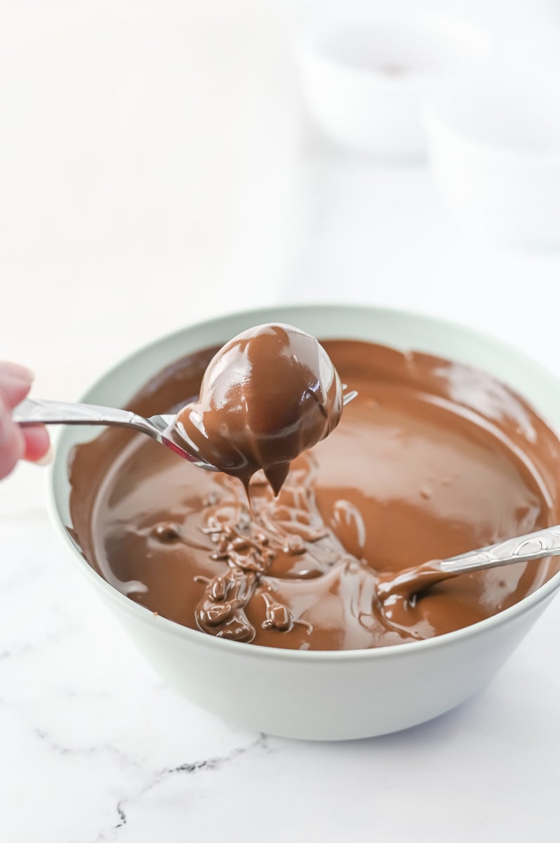 Oreo balls are dipped in chocolate.