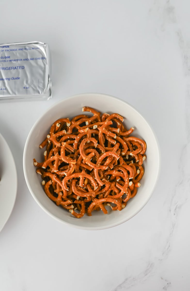 Pretzels broken into antler shapes in small bowl.