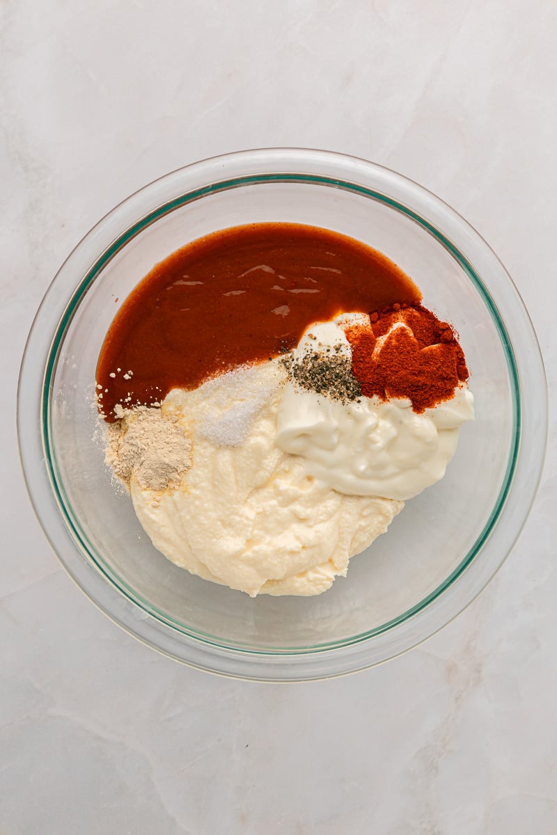 Cottage cheese mixture is added to the bowl with next set of ingredients.