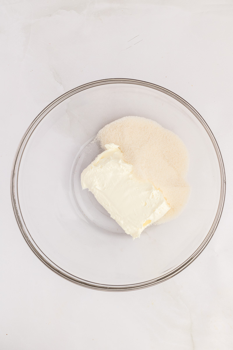 Cream cheese and sugar in mixing bowl.