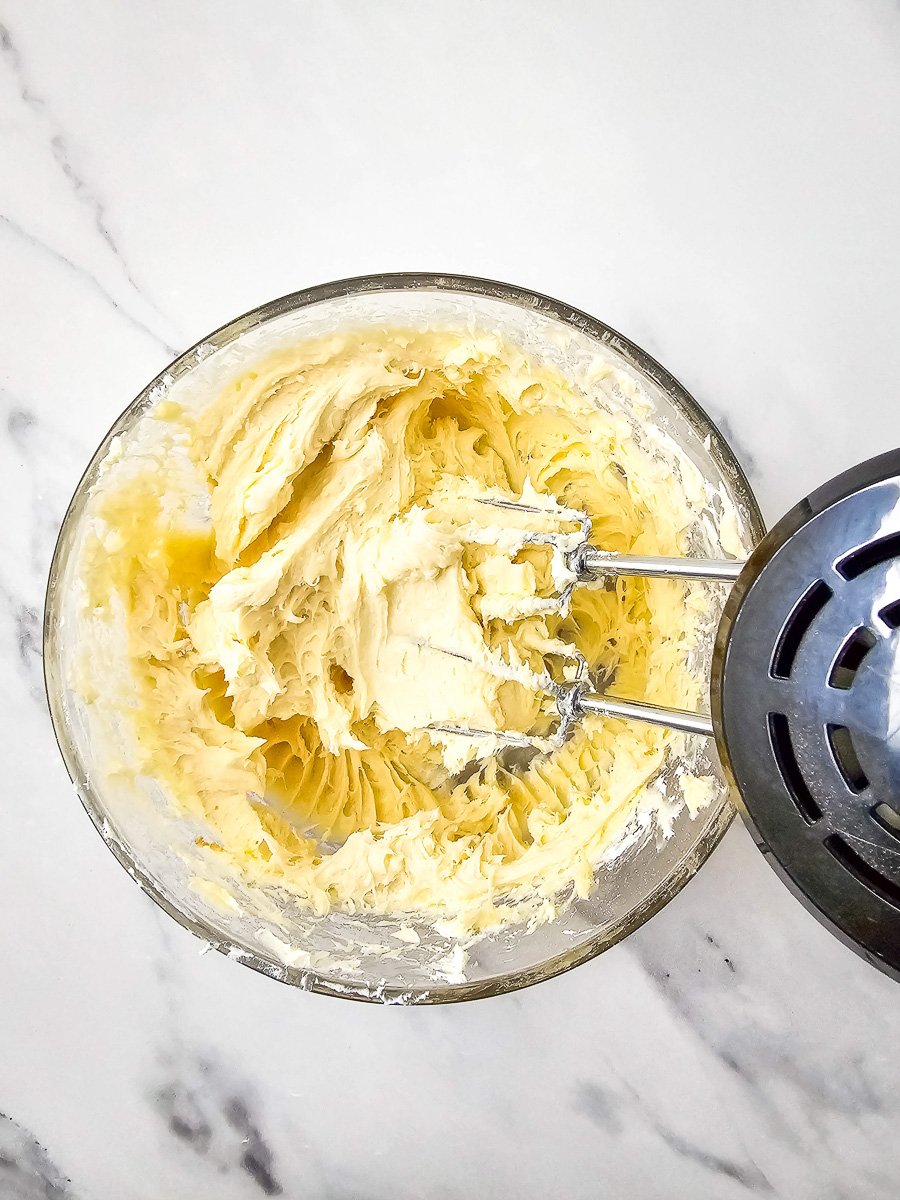 Brown sugar, powdered sugar and vanilla are adde to mixing bowl.