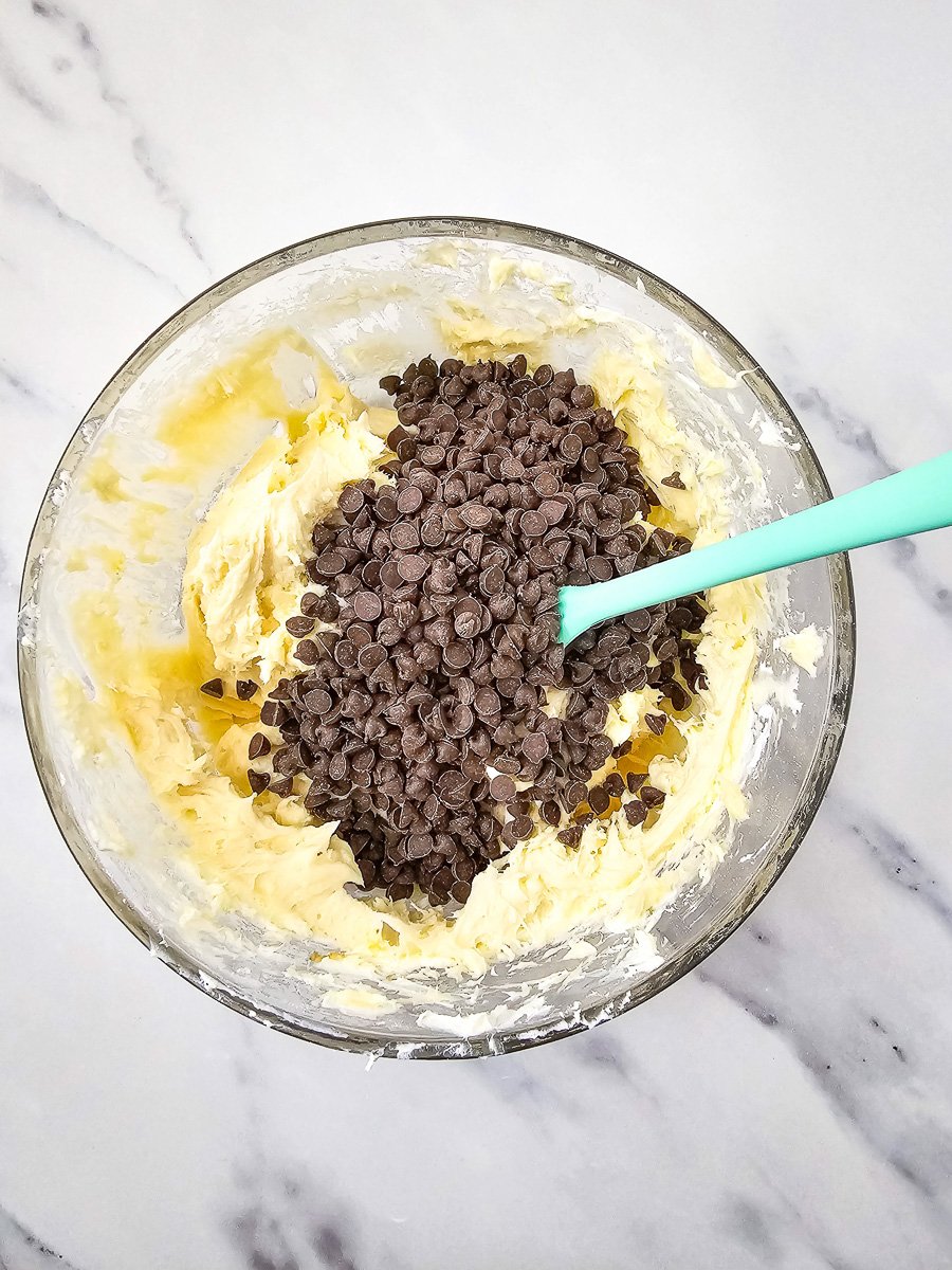 Chocolate chip are added to the mixing bowl.