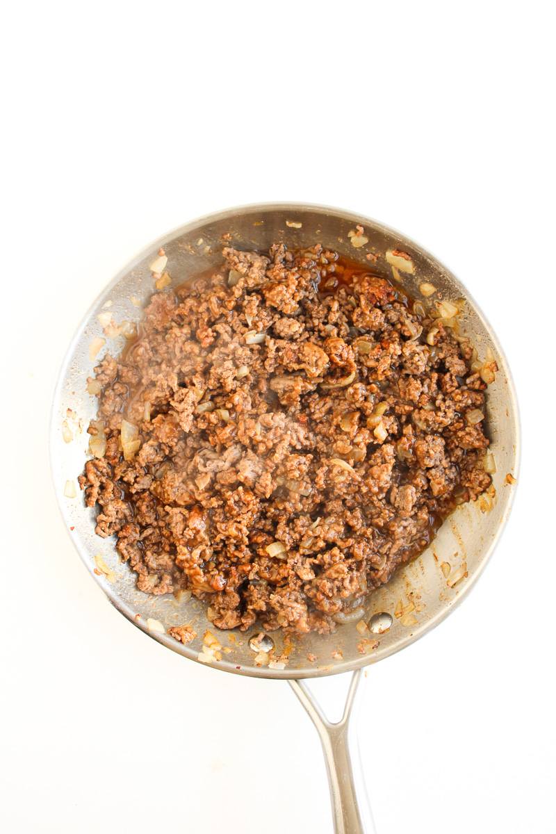 Cooked ground beef in skillet.