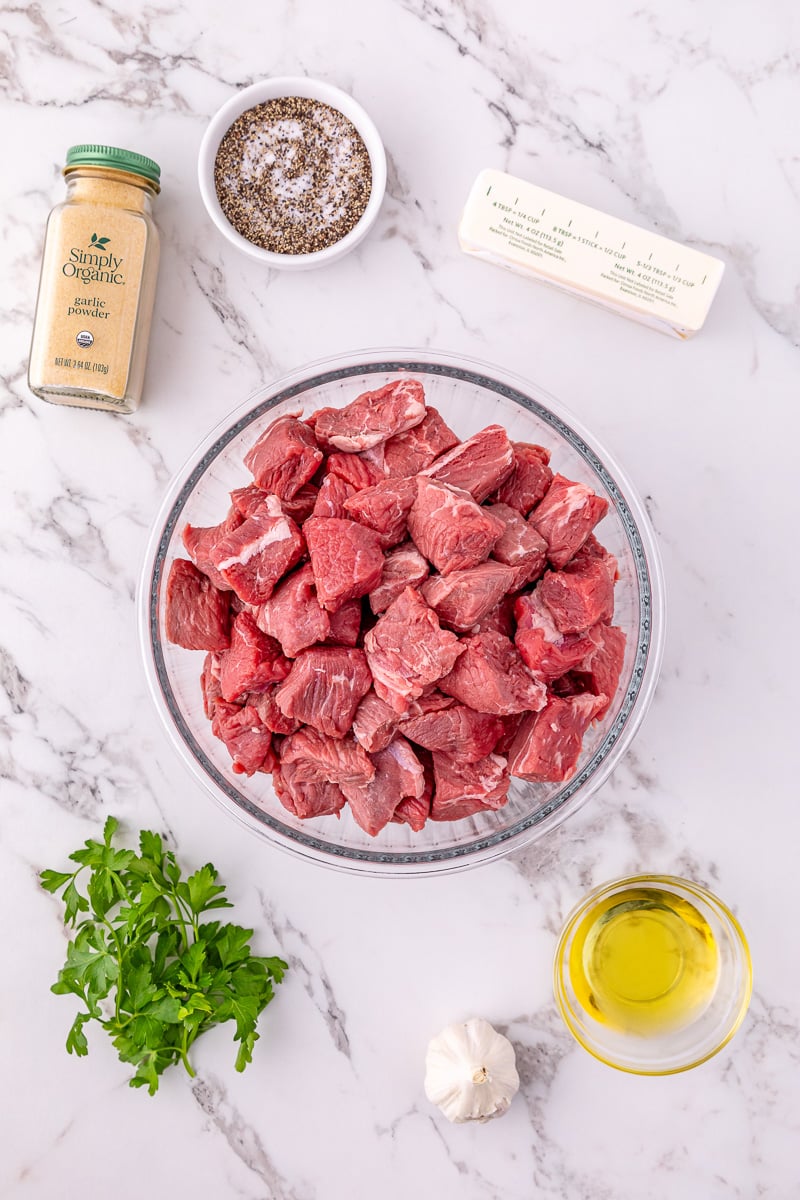 Ingredients for garlic butter steak bites laid out of counter, prepped for making the recipe.