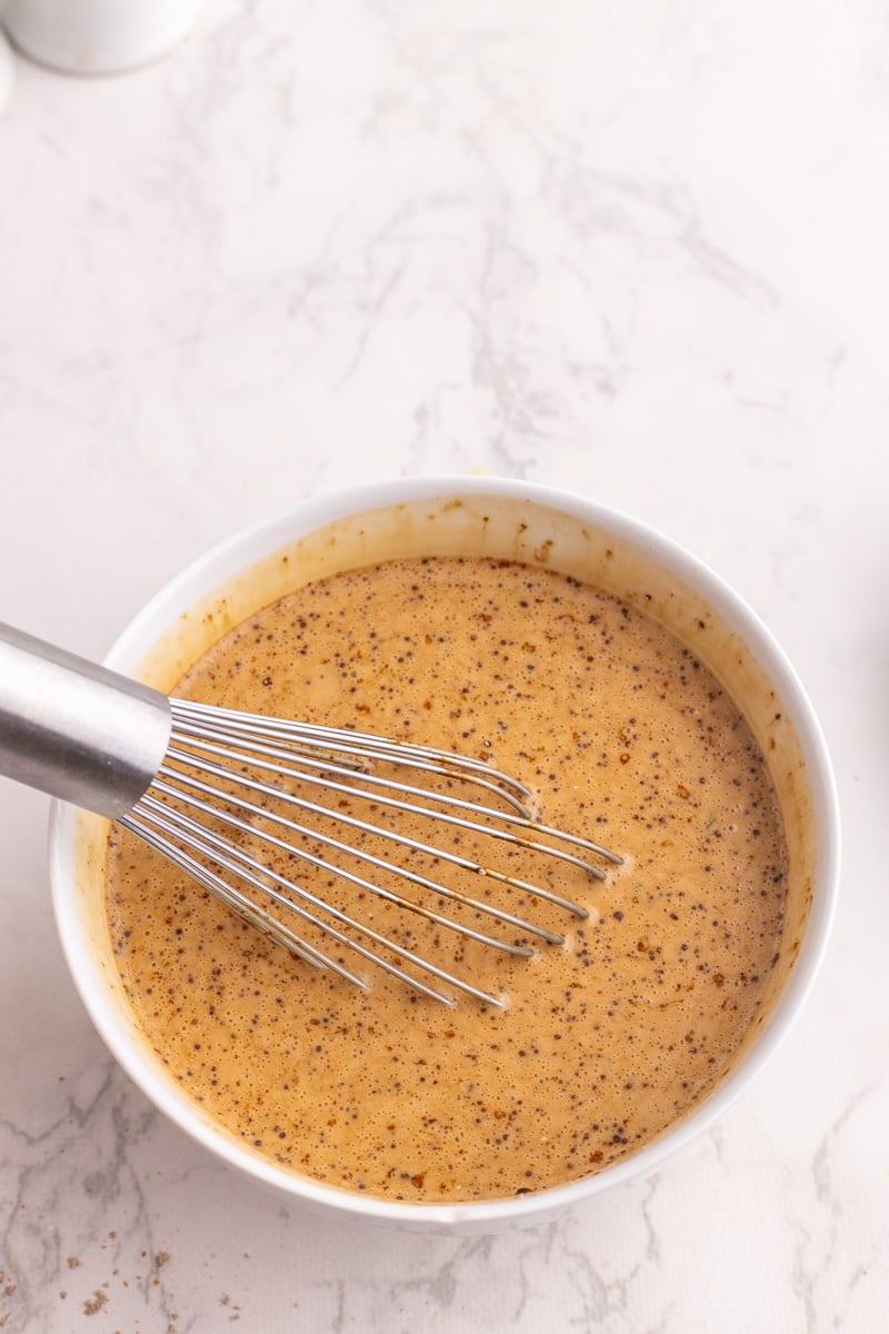 Sauce ingredients in small bowl with whisk.