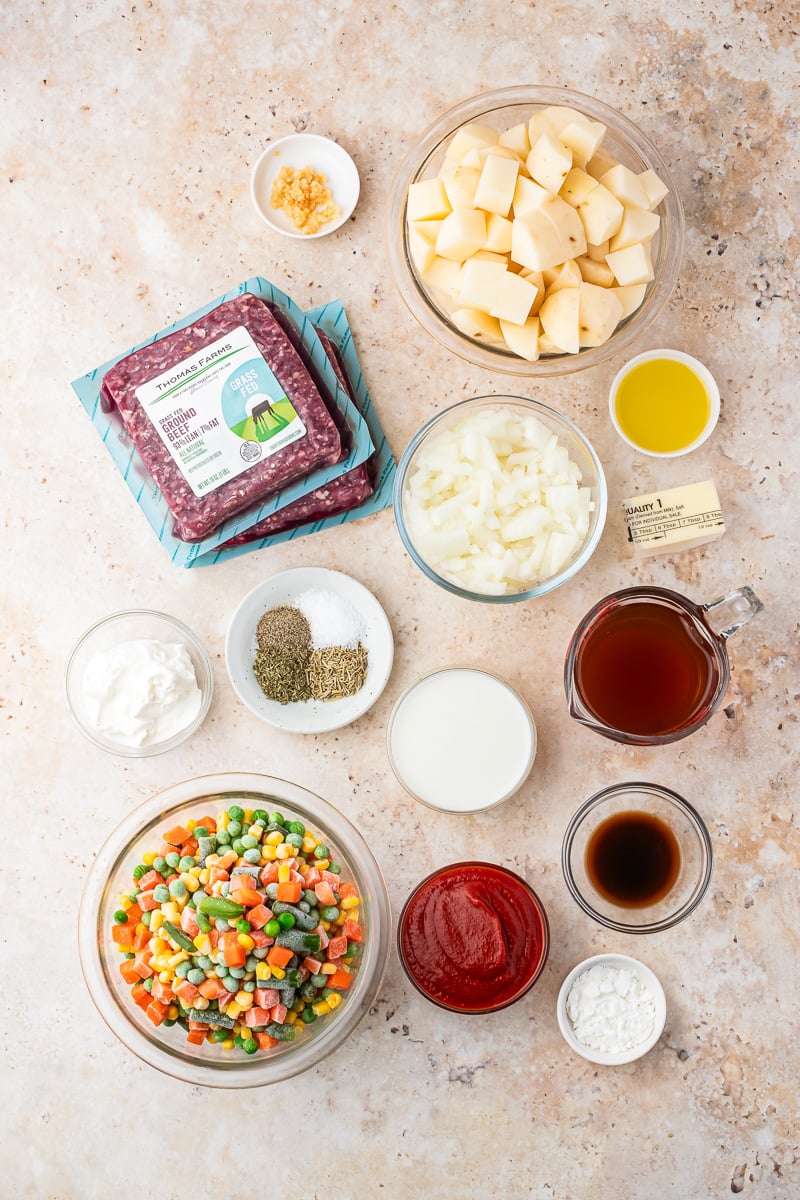 Ingredients for crockpot cottage pie laid out on kitchen counter in preparation for the recipe.