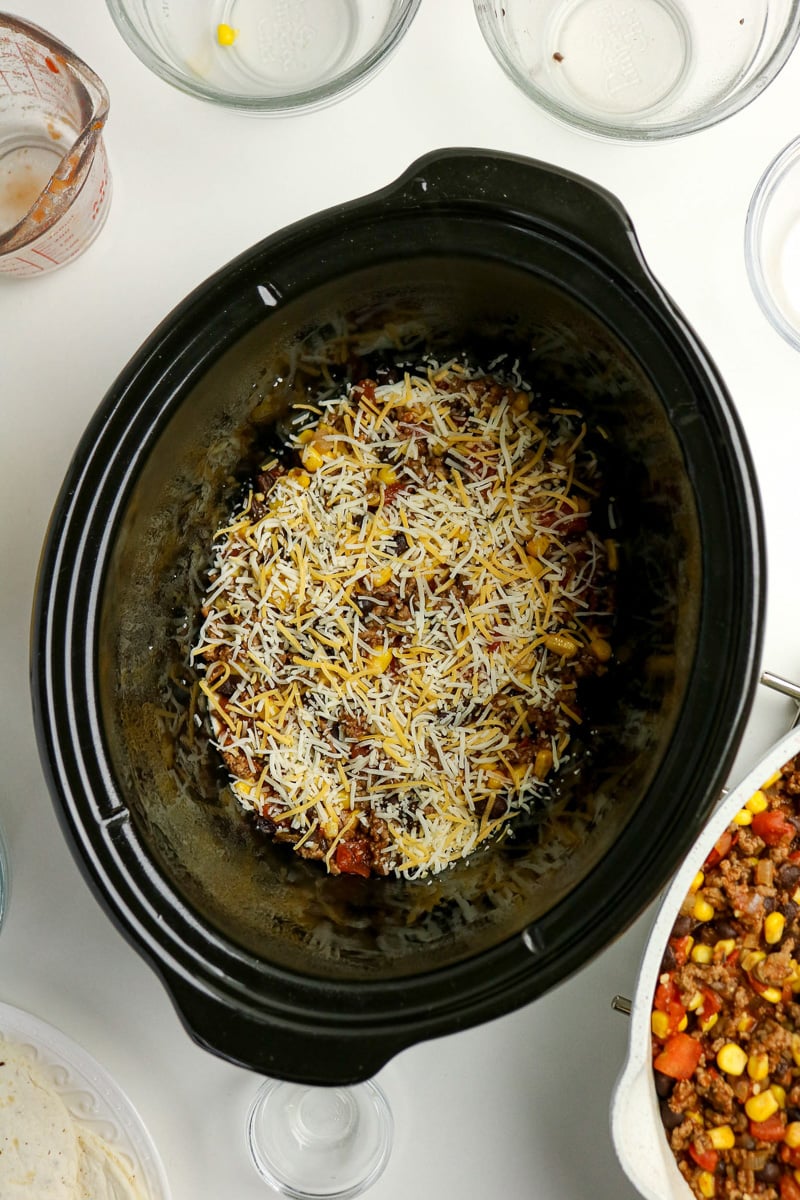 Cheese is sprinkles on top of meat mixture.