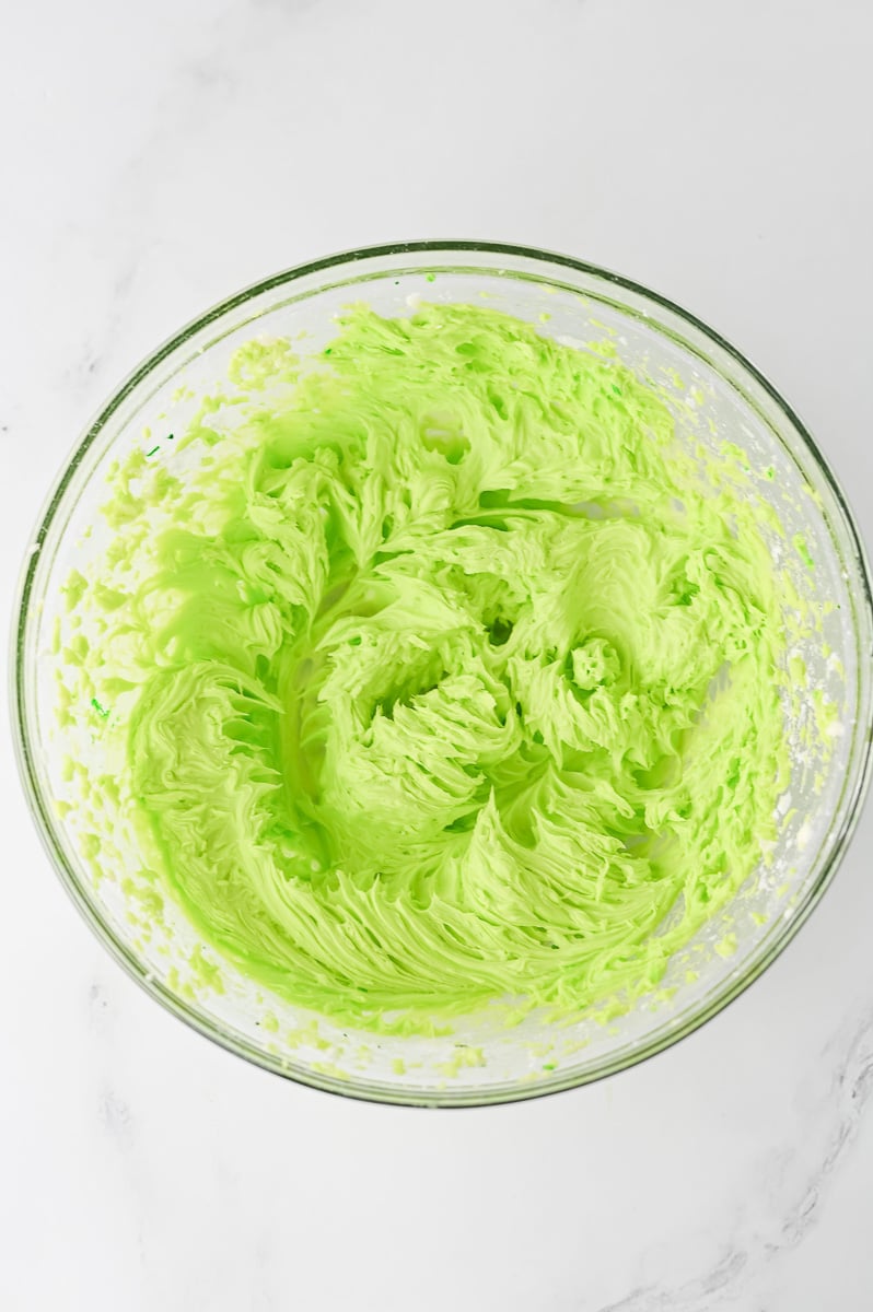 Green frosting in mixing bowl.