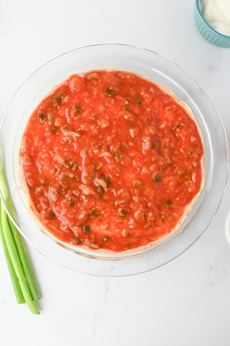 Salsa is layered on top of the sour cream mixture.
