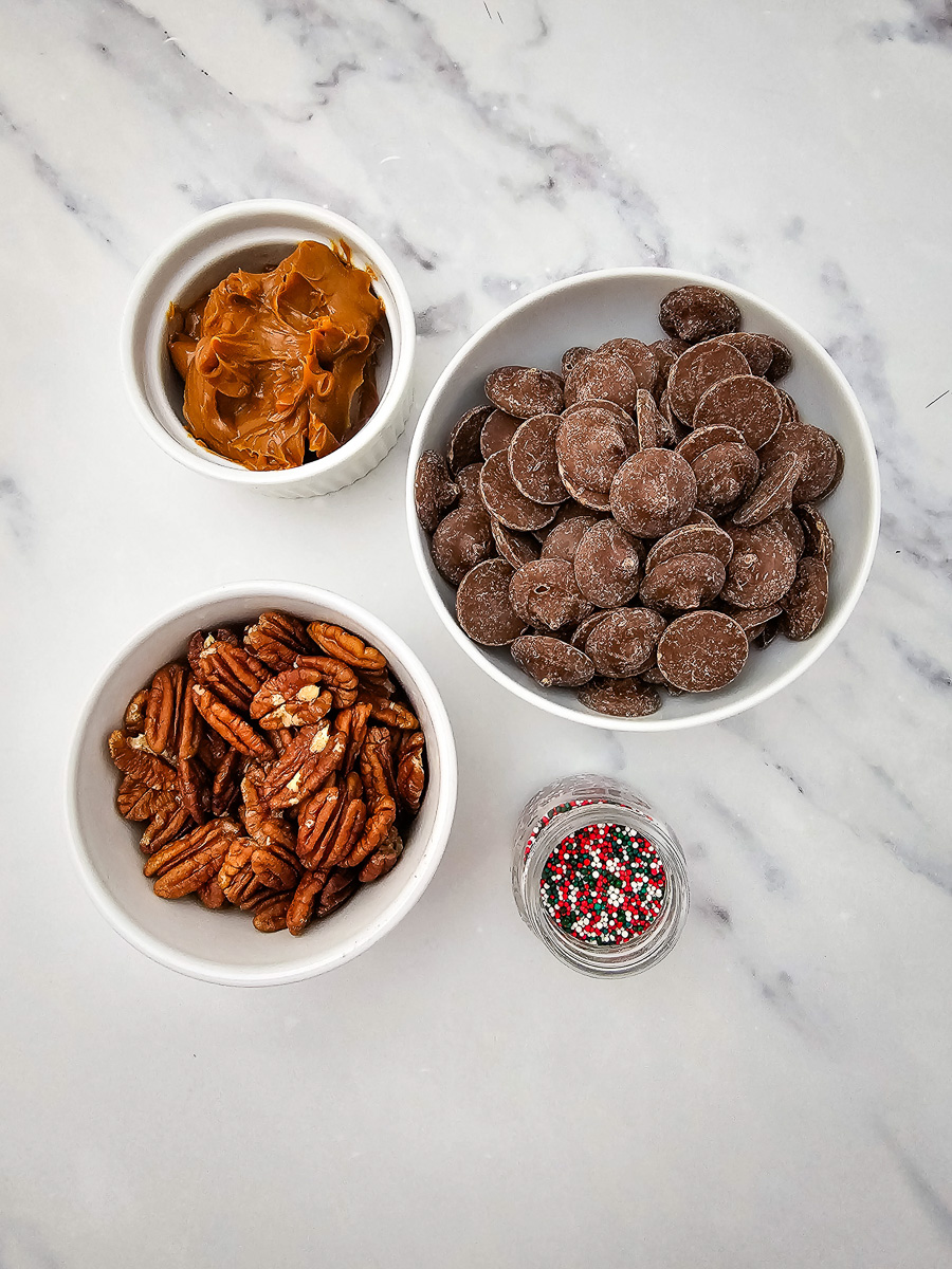 Ingredients for pecan caramel clusters in small bowl on counter prepared for the recipe.